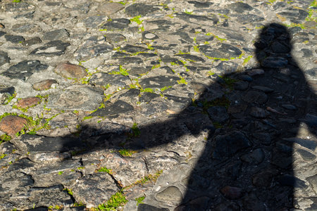 Human shadow silhouette on the old stone street of the historic center of Salvador, Pelourinho. Salvador Bahia Brazil.の写真素材