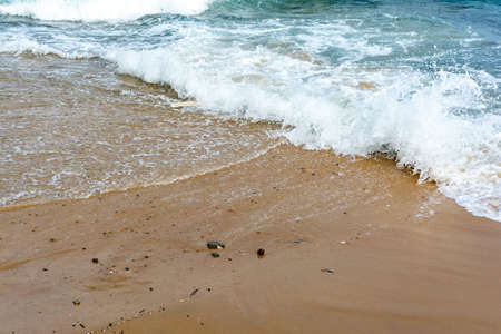 Waves lapping the sands of Ponta do HumaitÃ¡ beach. Salvador Bahia Brazil.の写真素材