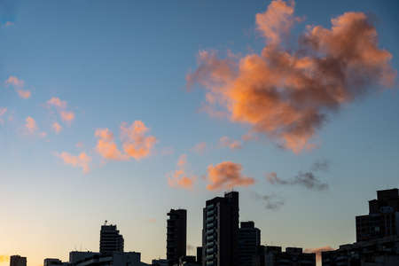 Salvador, Bahia, Brazil - June 06, 2021; Beautiful colorful sunset with clouds on the Rio Vermelho beach in Salvador, Bahia.の写真素材