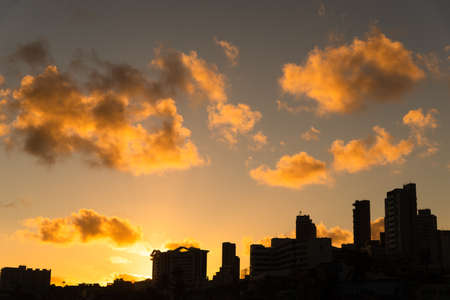 Salvador, Bahia, Brazil - June 06, 2021; Beautiful colorful sunset with clouds on the Rio Vermelho beach in Salvador, Bahia.の写真素材