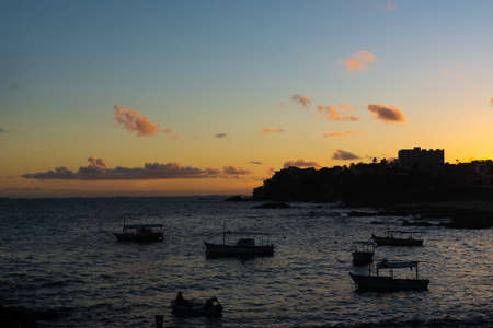 Salvador, Bahia, Brazil - June 06, 2021; Beautiful colorful sunset with clouds on the Rio Vermelho beach in Salvador, Bahia.のeditorial素材