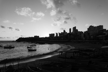 Salvador, Bahia, Brazil - June 06, 2021; Beautiful black and white sunset with dramatic clouds on...