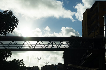 Salvador, Bahia, Brazil - June 06, 2021: Silhouette of a person walking on the catwalk in the late afternoon.の写真素材