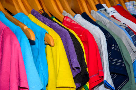 Lots of colored shirts on the hanger tidy and washed for use. Salvador Bahia Brazil.