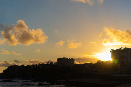 Salvador, Bahia, Brazil - June 06, 2021; Beautiful colorful sunset with clouds on the Rio Vermelho...
