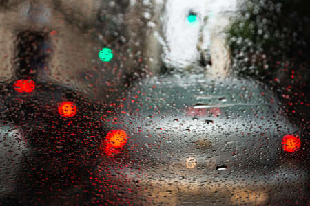 Salvador, Bahia, Brazil - June 13, 2021: Blurred colored lights through the car window with...