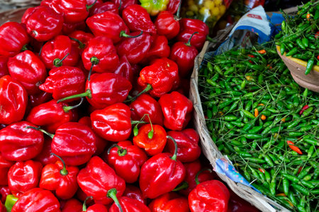 Red and green pepper for sale at the famous and grandiose SÃ£o Joaquim fair. Salvador, Bahia, Brazilの写真素材