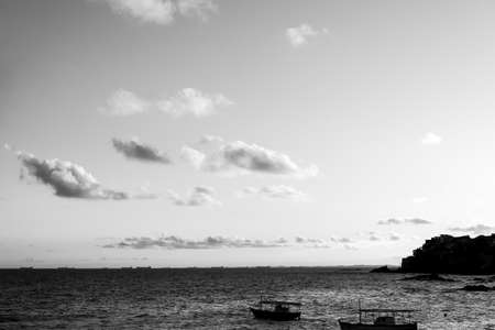 Salvador, Bahia, Brazil - June 06, 2021; Beautiful black and white sunset with dramatic clouds on the Rio Vermelho beach in Salvador, Bahia.のeditorial素材