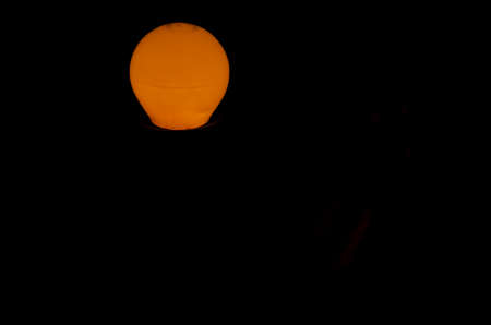 Yellow light in the darkness of the fully enclosed room. Salvador Bahia Brazil.の写真素材