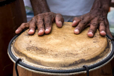 Hands of a musician playing percussion in presentation. Salvador, Bahia, Brazil.の写真素材