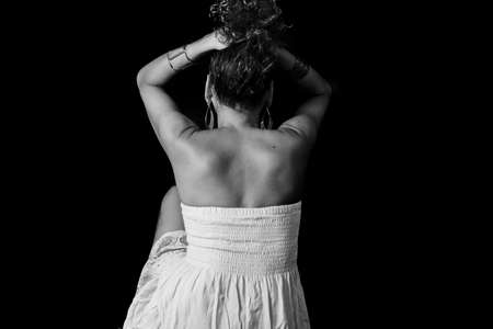 Afro-Brazilian model portrait in studio with black background. Concept of awareness, maturity and femininity. Salvador Bahia Brazil.の写真素材