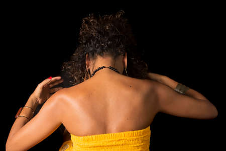 Afro-Brazilian model portrait in studio with black background. Concept of awareness, maturity and...