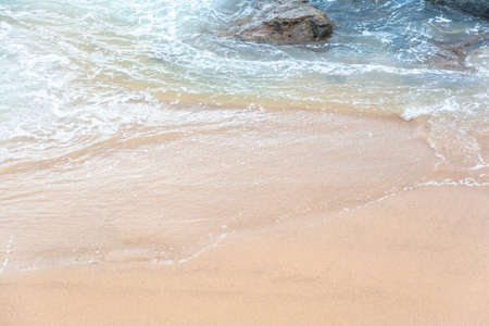 Sea waves from Praia do Rio Vermelho breaking on the clear sands. Salvador, Bahia, Brazil.の写真素材
