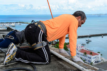 Salvador, Bahia, Brazil - March 12, 2017: Man preparing to practice Rappel on Elevador Lacerda, the...
