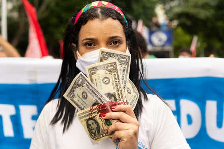 Salvador, Bahia, Brazil - July 03, 2021: People wearing protective mask and protesting against Brazilian President Jair Bolsonaro. Salvador Bahia Brazil.のeditorial素材