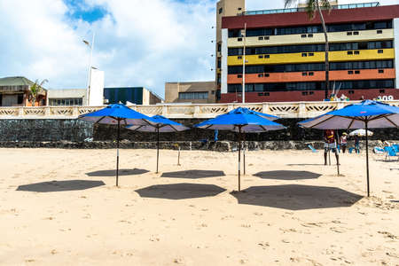 Salvador, Bahia, Brazil - October 13, 2019: Blue sombreros at Farol da Barra beach in Salvador, Bahia, Brazil.のeditorial素材