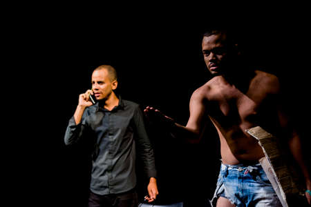 Actor representing a character on the stage of a theater. He makes various gestures and expressions...