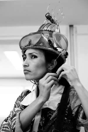 Actress representing a character on the stage of a theater. He makes various gestures and expressions with his body. Sesi Theater, Salvador, Bahia, Brazil.の写真素材