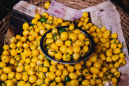 Yellow peppers for sale at the famous and grandiose SÃ£o Joaquim fair in Salvador, Bahia, Brazil.