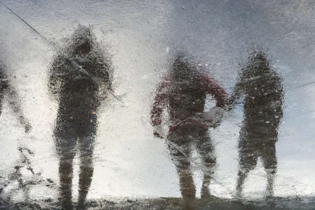 Reflection of fishermen in the external area of the colony where fish are sold and kept. Salvador, Bahia, Brazil.の写真素材