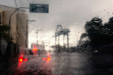 Daily traffic ,view through the window on rainy day. Salvador, Bahia, Brazil