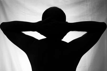 Black and white portrait in Silhouette of a man against white background. Salvador, Bahia, Brazil.の写真素材