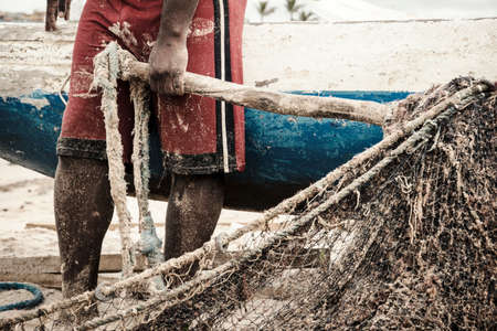 Salvador, Bahia, Brazil - January 11, 2019: Fishermen taking the big net to the colony.のeditorial素材