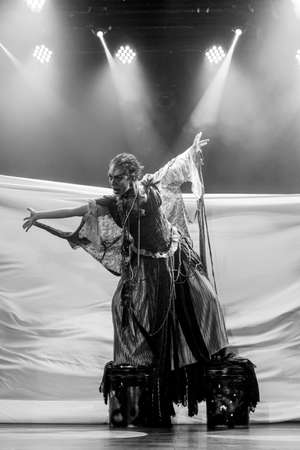 actress representing a character on the stage of a theater. He makes various gestures and expressions with his body. Sesi Theater, Salvador, Bahia, Brazil.の写真素材