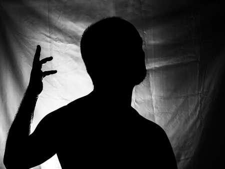 Black and white portrait in Silhouette of a man against white background. Salvador, Bahia, Brazil.