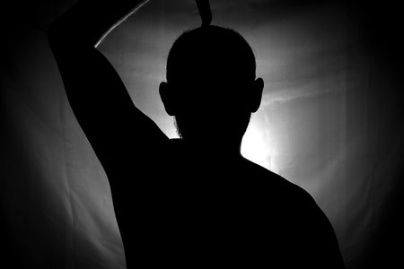 Black and white portrait in Silhouette of a man against white background. Salvador, Bahia, Brazil.の写真素材