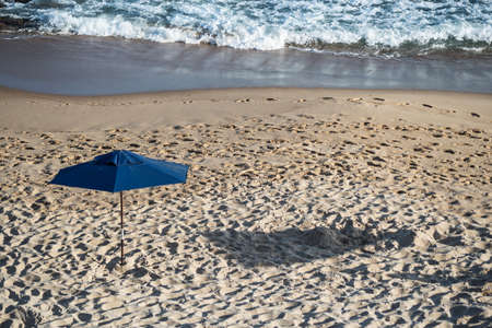 Sunshade on the beach in the strong sun of the day. Patiencia Beach in Salvador, Bahia, Brazil.の写真素材