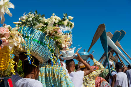 Salvador, Bahia, Brazil - January 20, 2019: Traditional party in honor of Iemanja, the queen of the sea, where gifts are taken to the sea by members of the religion.のeditorial素材