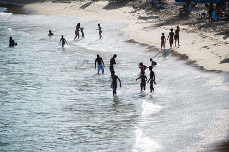 Salvador, Bahia, Brazil - September 05, 2021: People bathing in the water at Paciencia beach in Salvador, Bahia, Brazil.のeditorial素材