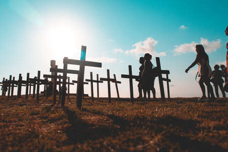 Salvador, Bahia, Brazil - October 01, 2021: Crosses fixed to the ground in honor of those killed by Covid-19 at Farol da Barra in Salvador, Bahia, Brazil.のeditorial素材