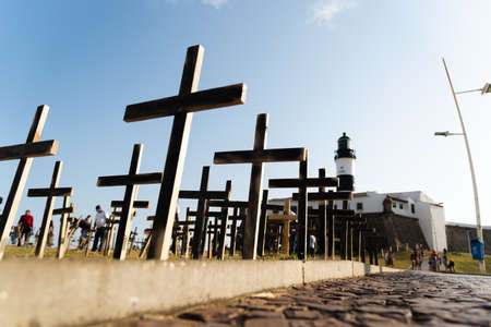 Salvador, Bahia, Brazil - October 01, 2021: Crosses fixed to the ground in honor of those killed by Covid-19 at Farol da Barra in Salvador, Bahia, Brazil.のeditorial素材