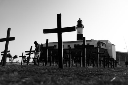 Salvador, Bahia, Brazil - October 01, 2021: Crosses fixed to the ground in honor of those killed by Covid-19 at Farol da Barra in Salvador, Bahia, Brazil.のeditorial素材