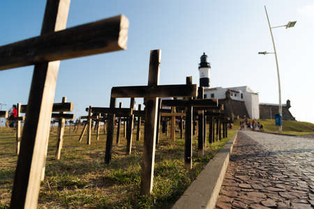 Salvador, Bahia, Brazil - October 01, 2021: Crosses fixed to the ground in honor of those killed by Covid-19 at Farol da Barra in Salvador, Bahia, Brazil.のeditorial素材
