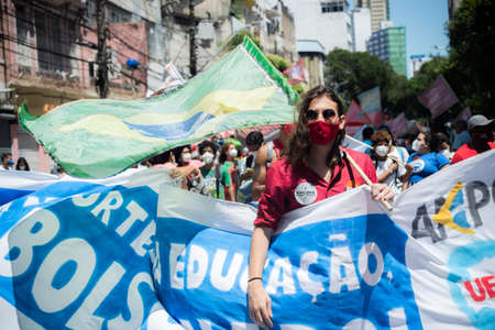 Salvador, Bahia, Brazil - September 07, 2021: Brazilians protest with banners and posters against the government of President Jair Bolsonaro in the city of Salvador, in the state of Bahia.のeditorial素材