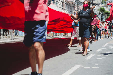 Salvador, Bahia, Brazil - September 07, 2021: Brazilians protest with banners and posters against the government of President Jair Bolsonaro in the city of Salvador, in the state of Bahia.のeditorial素材