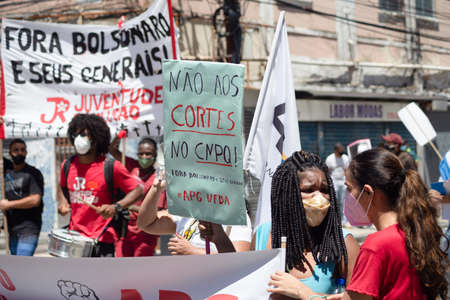 Salvador, Bahia, Brazil - September 07, 2021: Brazilians protest with banners and posters against the government of President Jair Bolsonaro in the city of Salvador, in the state of Bahia.のeditorial素材