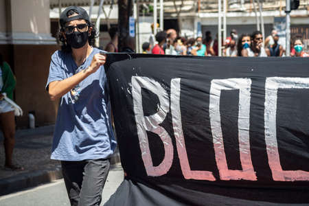 Salvador, Bahia, Brazil - September 07, 2021: Brazilians protest with banners and posters against the government of President Jair Bolsonaro in the city of Salvador, in the state of Bahia.のeditorial素材