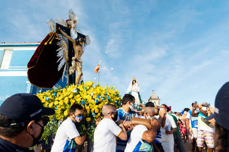 Salvador, Bahia, Brazil - December 31, 2021: Faithful carrying the andor with the image of Jesus Christ at the Catholic festival of Boa Viagem. Salvador, Bahia, Brazil.のeditorial素材