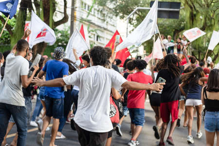Salvador, Bahia, Brazil - April 09, 2022: Brazilians protest with banners and posters against the government of President Jair Bolsonaro in the city of Salvador.のeditorial素材