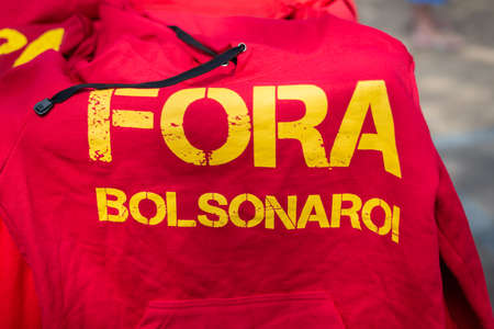 Salvador, Bahia, Brazil - October 02, 2021: Posters banners and shirts with words of Fora Bolsonaro...