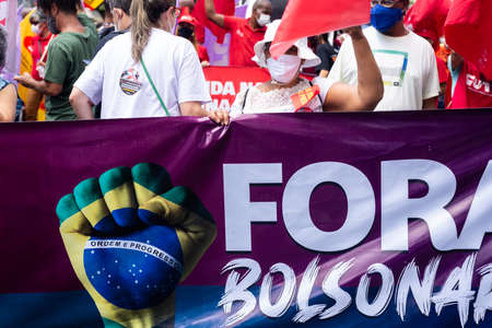 Salvador, Bahia, Brazil - October 02, 2021: Brazilians protest with banners and posters against the government of President Jair Bolsonaro in the city of Salvador.のeditorial素材