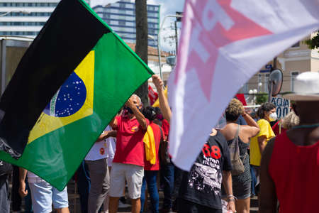 Salvador, Bahia, Brazil - October 02, 2021: Brazilians protest with banners and posters against the government of President Jair Bolsonaro in the city of Salvador.のeditorial素材