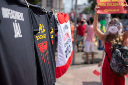 Salvador, Bahia, Brazil - October 02, 2021: Brazilians protest with banners and posters against the government of President Jair Bolsonaro in the city of Salvador.のeditorial素材