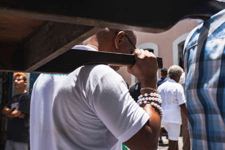 Salvador, Bahia, Brazil - January 13, 2019: Faithful in procession through the streets of Pelourinho in Salvador, Bahia, carrying the litter of the Catholic church.のeditorial素材