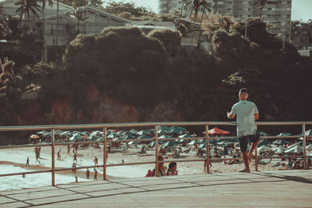 Salvador, Bahia, Brazil - November 01, 2021: People at PaciÃªncia beach in Salvador having fun and sunbathing.のeditorial素材