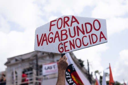 Salvador, Bahia, Brazil - October 02, 2021: Posters banners and shirts with words of Fora Bolsonaro at the protest held in the city of Salvador, capital of Bahia, Brazil.のeditorial素材